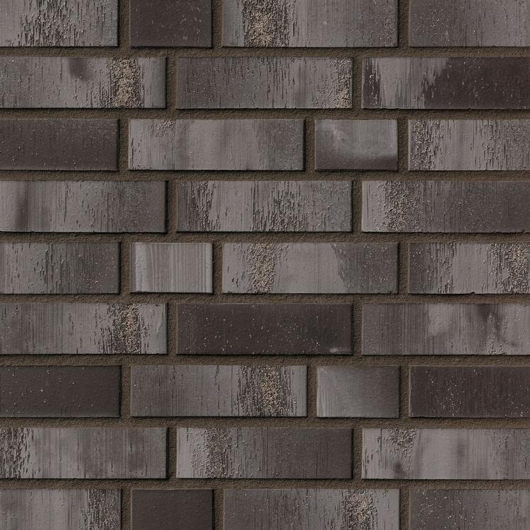 Dunkelgraue Backsteinmauer mit gleichmäßiger Anordnung.