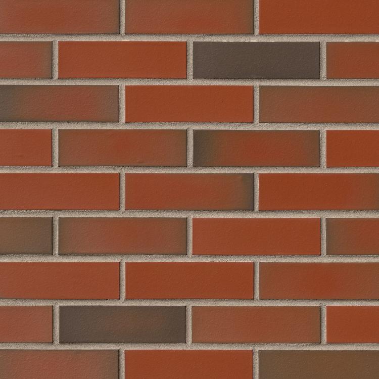 Rote und braune Backsteinwand mit gleichmäßigen Fugen.