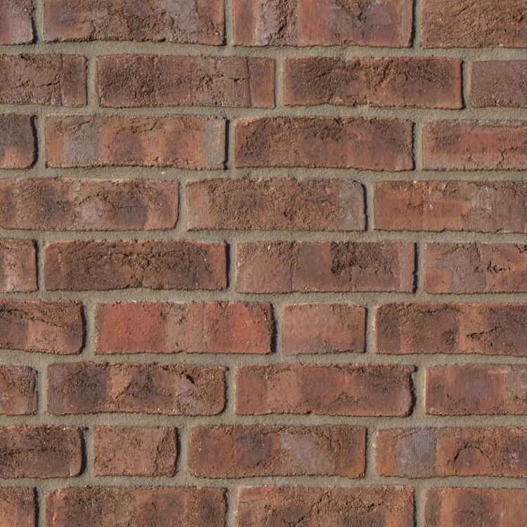 Rote Backsteinmauer, gleichmäßiges Muster.