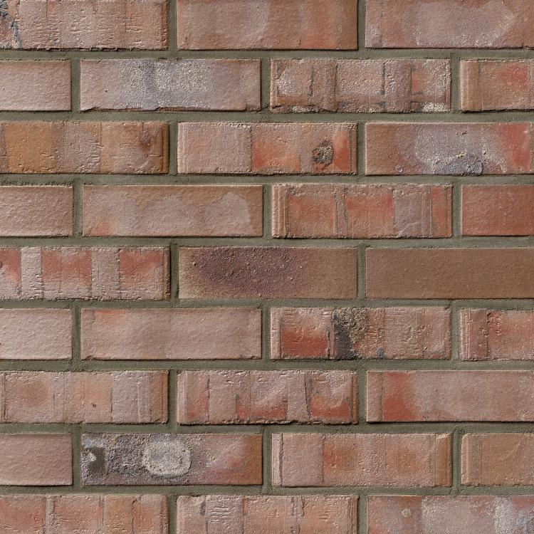 Ziegelsteinmauer mit rötlich-braunen und grauen Ziegeln.