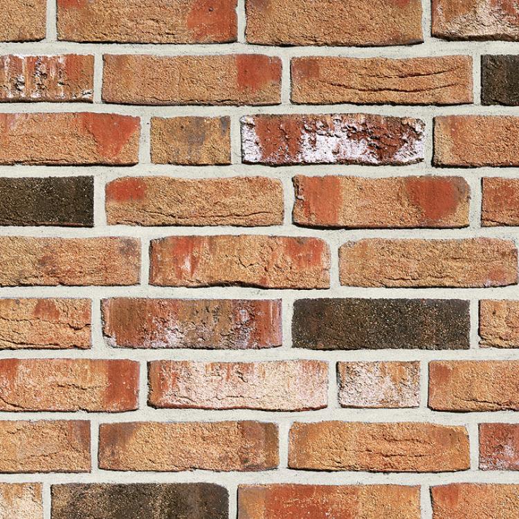 Backsteinmauer mit roten und braunen Ziegeln.