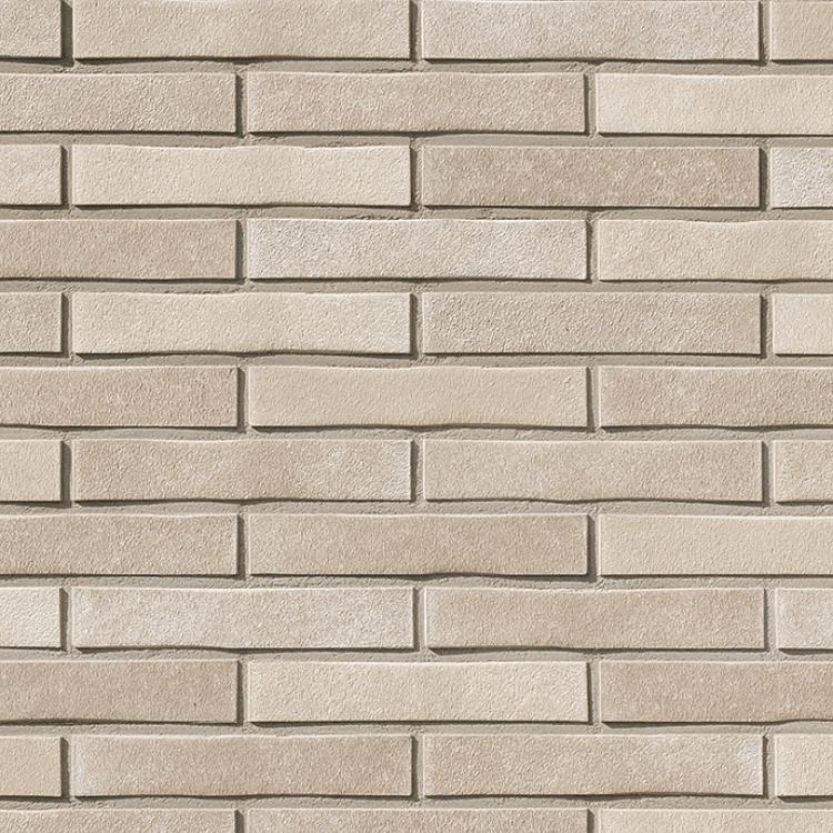 Beige Ziegelmauer, gleichmäßig angeordnet.