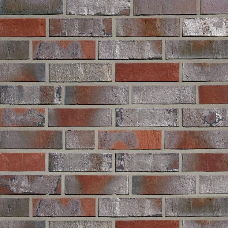 Ziegelmauer in Rottönen mit grauen Fugen.